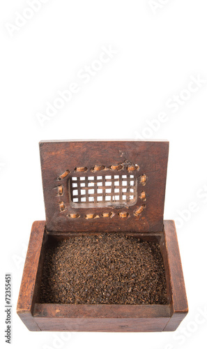 Dried, processed and blended tea leaves in wooden box