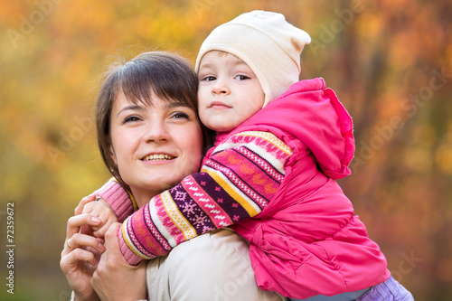 beautiful mother with toddl...