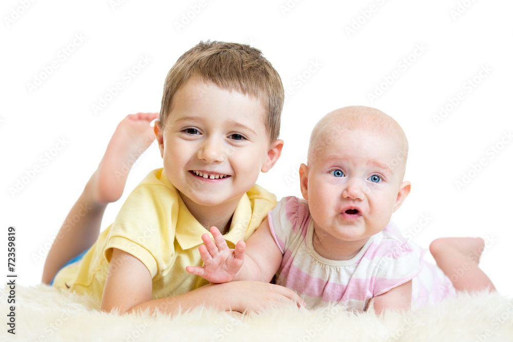 Cute kids brother and sister lying on floor