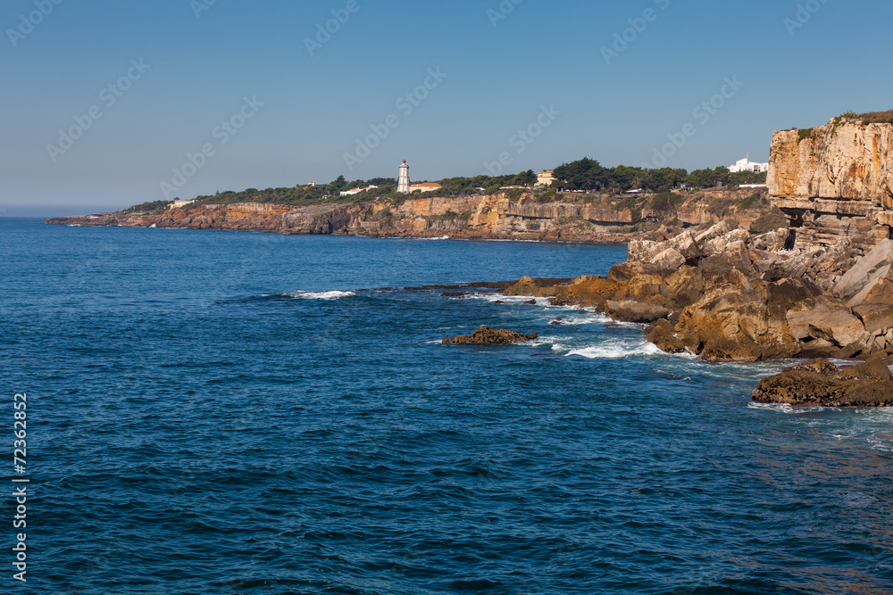 Rocky coastline with lighthouse Rocky coastline with lighthouse