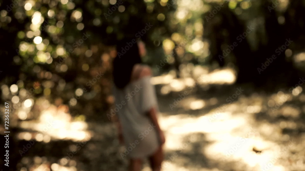 Woman scared in the woods running away