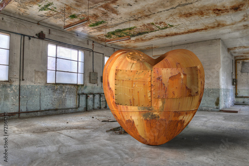 Rusty, old, broken heart in a derelict building. © marcel