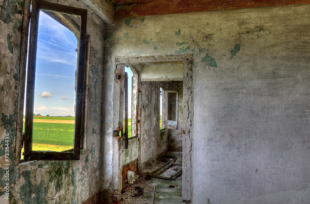 Fototapeta premium Abandoned, derelict building interior with nice view.