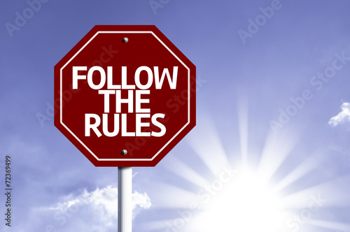 Follow the Rules written on red road sign