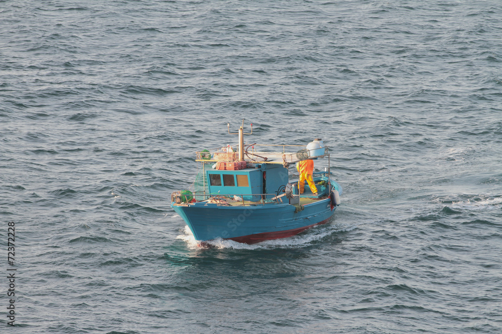 Fishing schooner going by sea