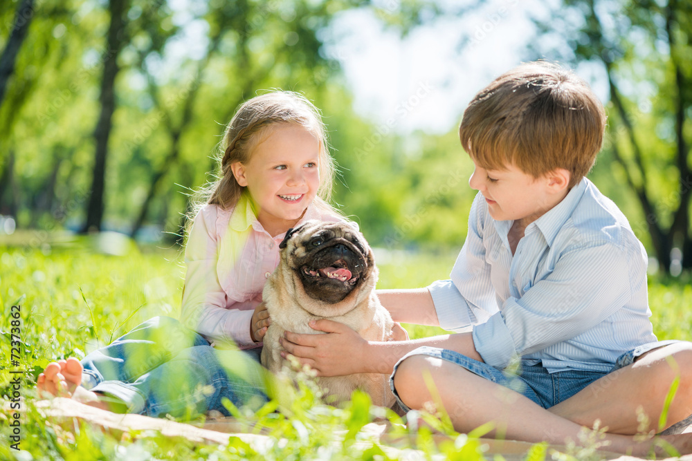 Children in park with pet Children in park with pet