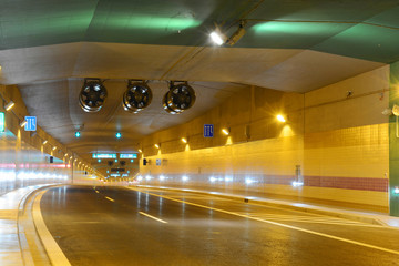 Fotobehang Tunnel Moderne verlichte tunnel met gele lampen  © holublu6