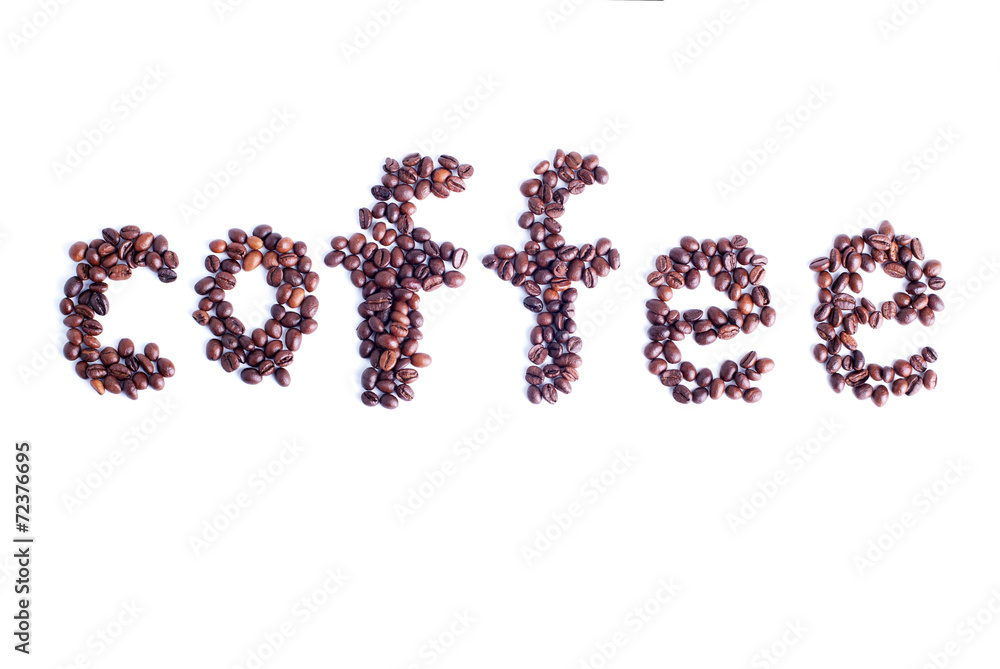 coffee beans are laid out in the form of the word coffee on a wh