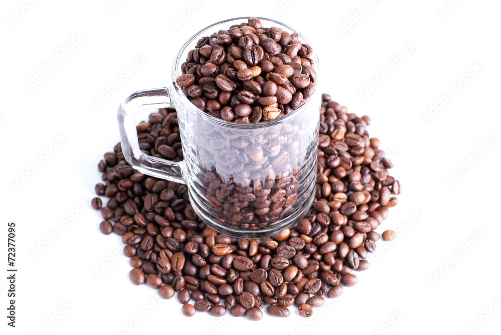 coffee beans in a glass cup isolated on white background coffee beans in a glass cup isolated on white background