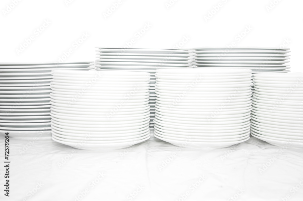 Obraz premium Many white different plates stacked together