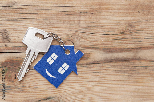 Keychain figure of house and key close up