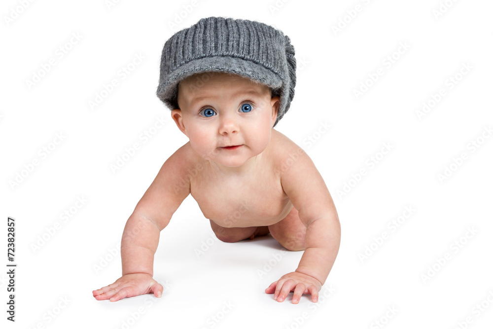 Baby in the winter hat crawling on camera Baby in the winter hat crawling on camera