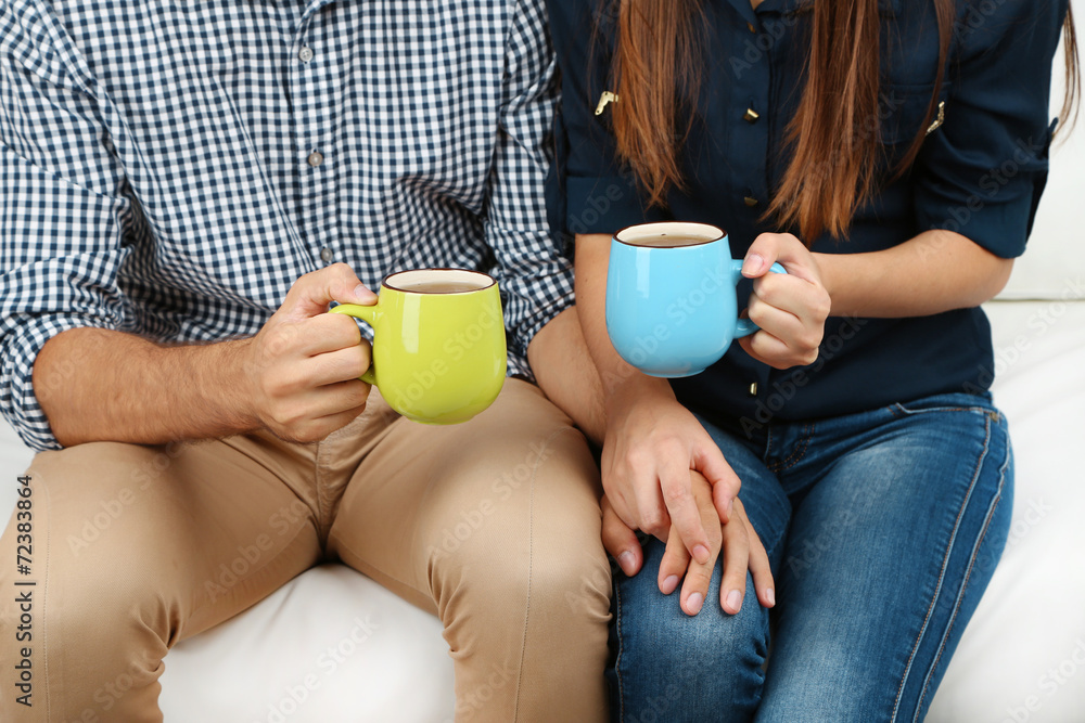 Loving couple with hot drinks Loving couple with hot drinks