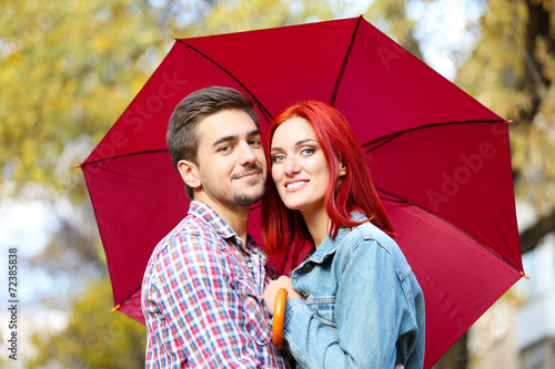 Loving couple under an umbr...