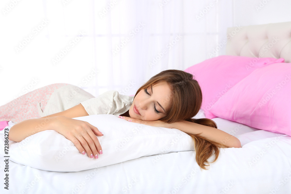 Young beautiful woman lying in bed Young beautiful woman lying in bed