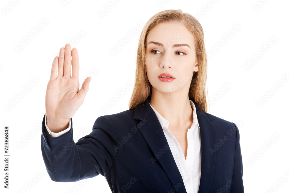 Businesswoman making stop sign Businesswoman making stop sign