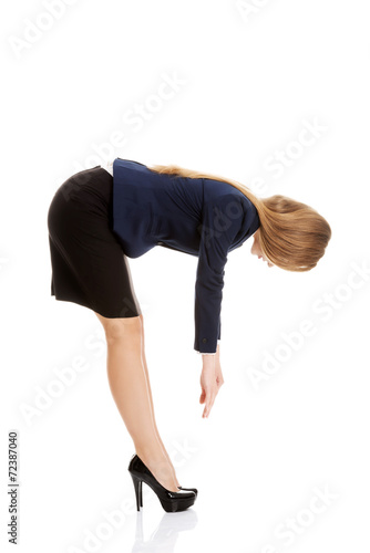 Business woman bend down
