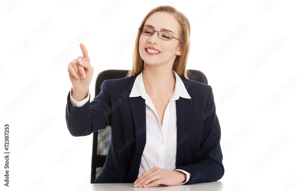 Businesswoman pointing her finger Businesswoman pointing her finger