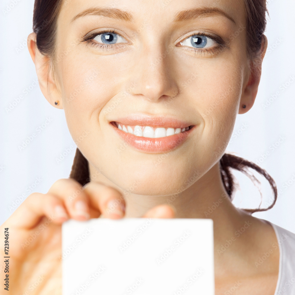 Business woman giving blank business card, at office