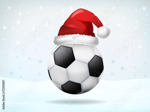 football ball covered with Santa cap