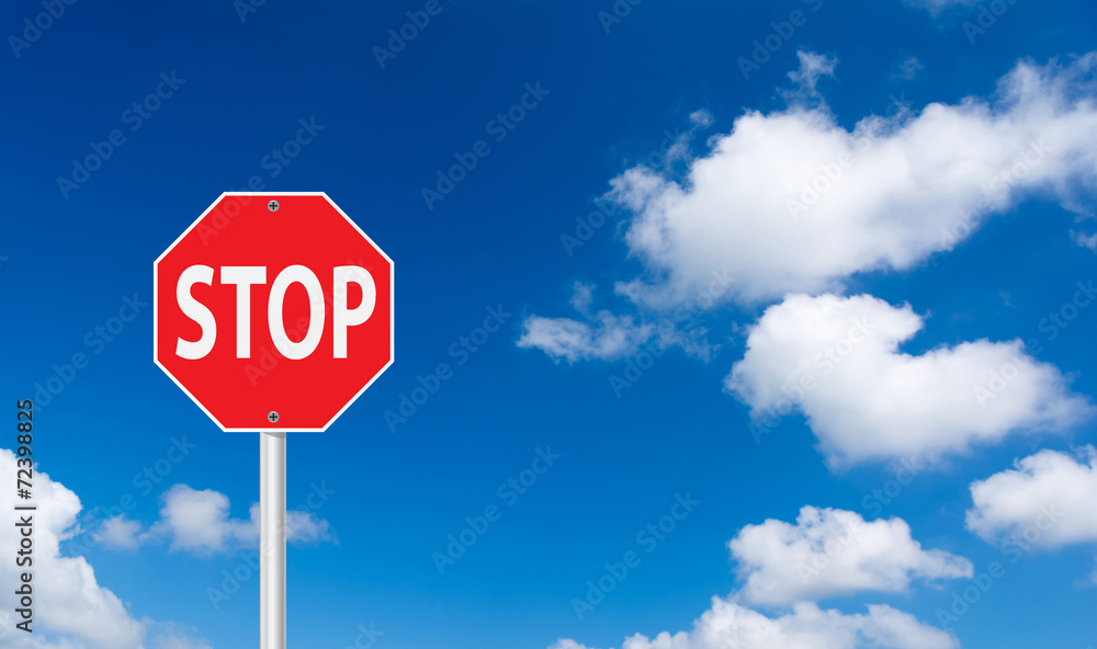 roadside red stop sign on a cloudy background. roadside red stop sign on a cloudy background.