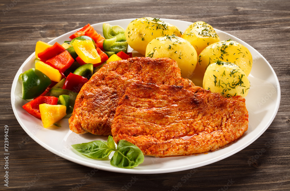 Pork chops, boiled potatoes and vegetables Pork chops, boiled potatoes and vegetables