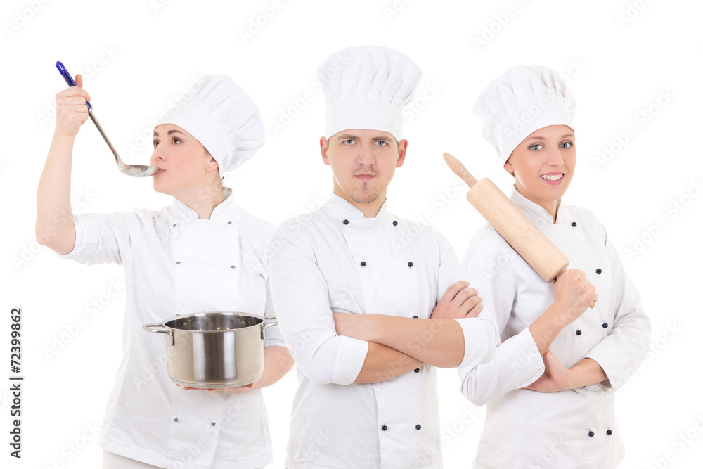 cooking concept - three young chefs isolated on white