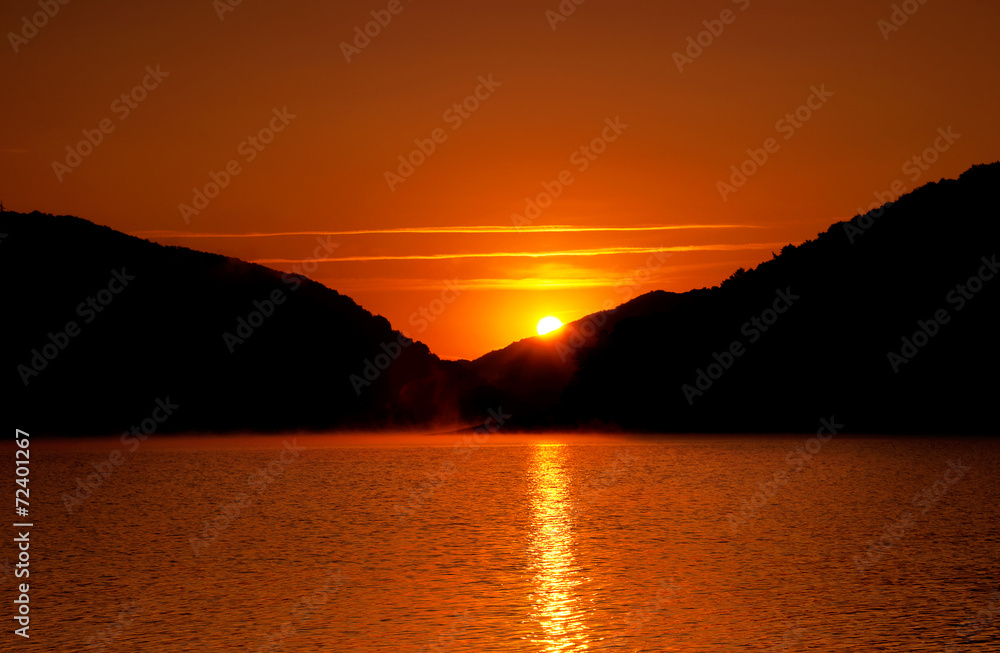 Beautiful sunrise on the lake shore