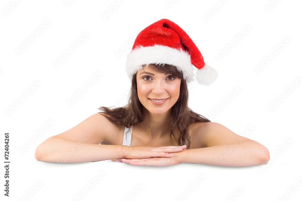 Festive brunette leaning on large poster Festive brunette leaning on large poster