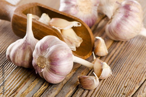 garlic whole and cloves on  wooden background