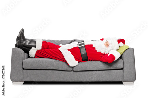 Santa Claus sleeping on a modern sofa