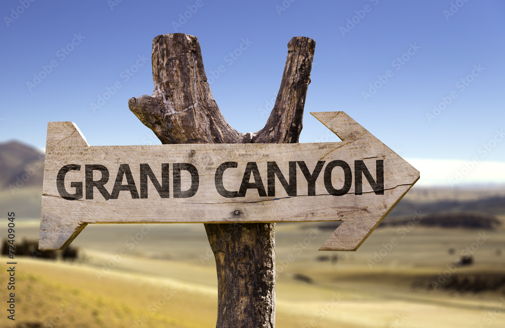 Grand Canyon wooden sign with a desert background
