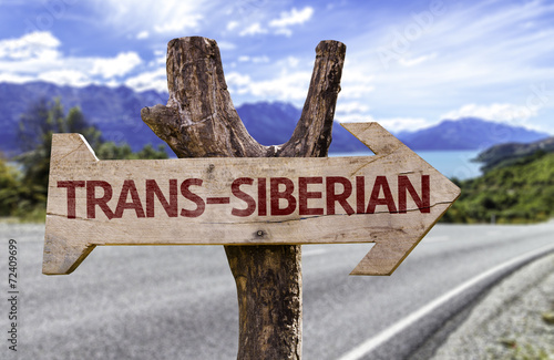 Trans-Siberian wooden sign with a railway on background
