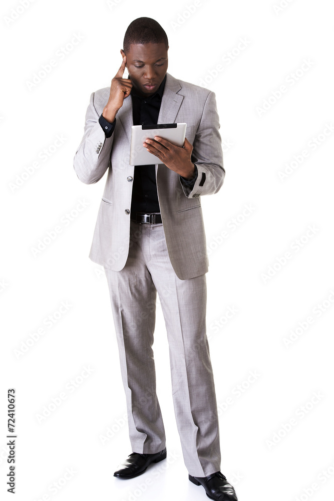 African man holding a tablet