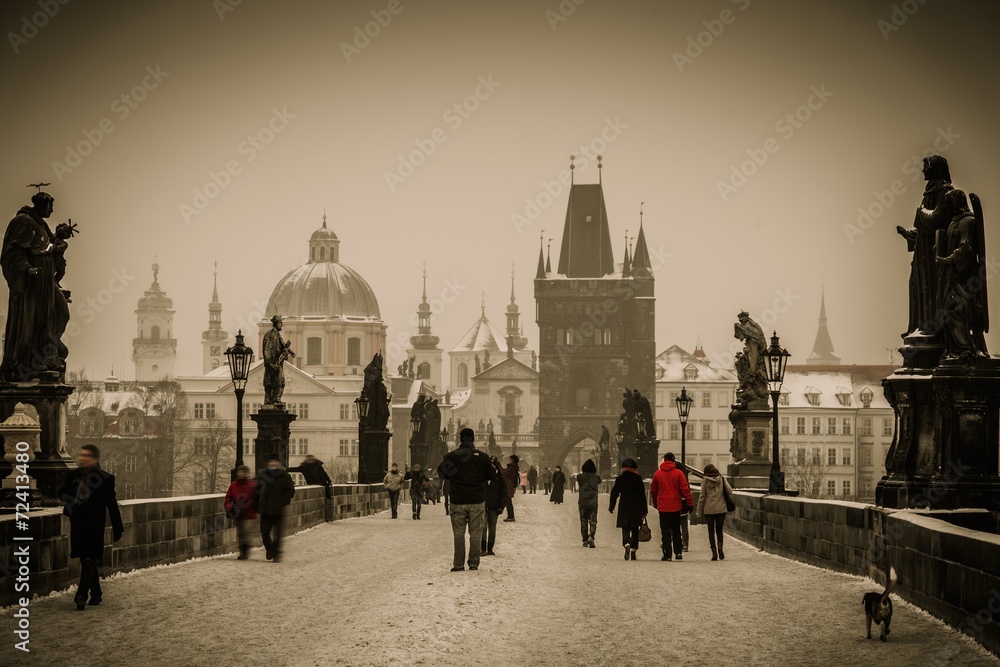 People walking on a Charles bridge in Prague