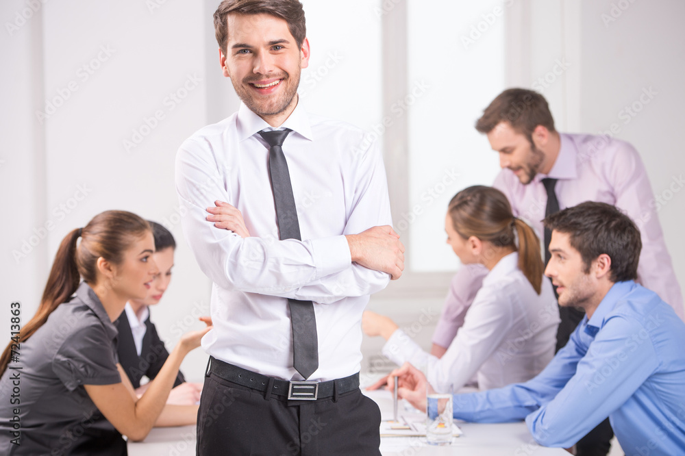 Business meeting - manager discussing work with his colleagues. Business meeting - manager discussing work with his colleagues.
