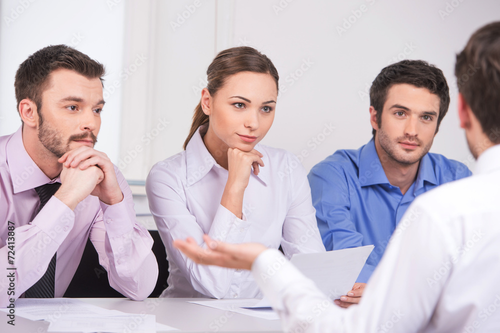 Group of young business people talking on business meeting. Group of young business people talking on business meeting.