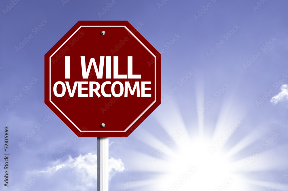 I Will Overcome written on red road sign I Will Overcome written on red road sign