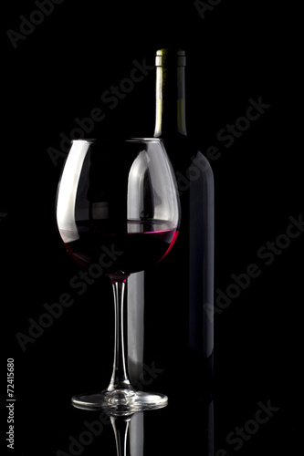 Red wine isolated on black