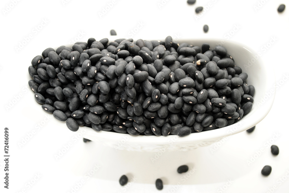 A Fancy White Bowl Filled with Black Beans A Fancy White Bowl Filled with Black Beans