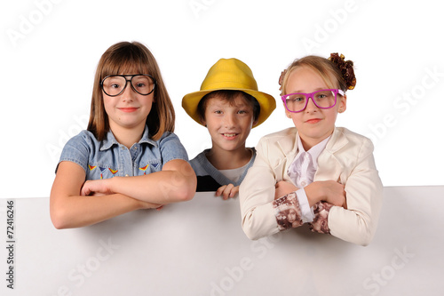 Portrait of happy children with white blank photo