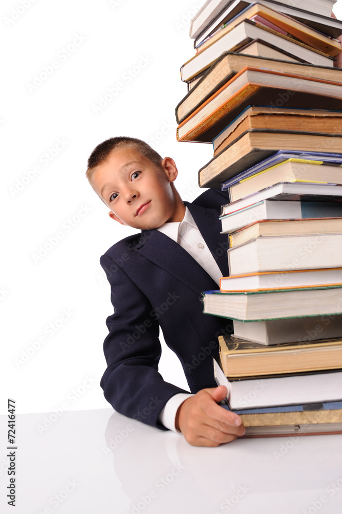 Schoolboy with huge stack of books Schoolboy with huge stack of books