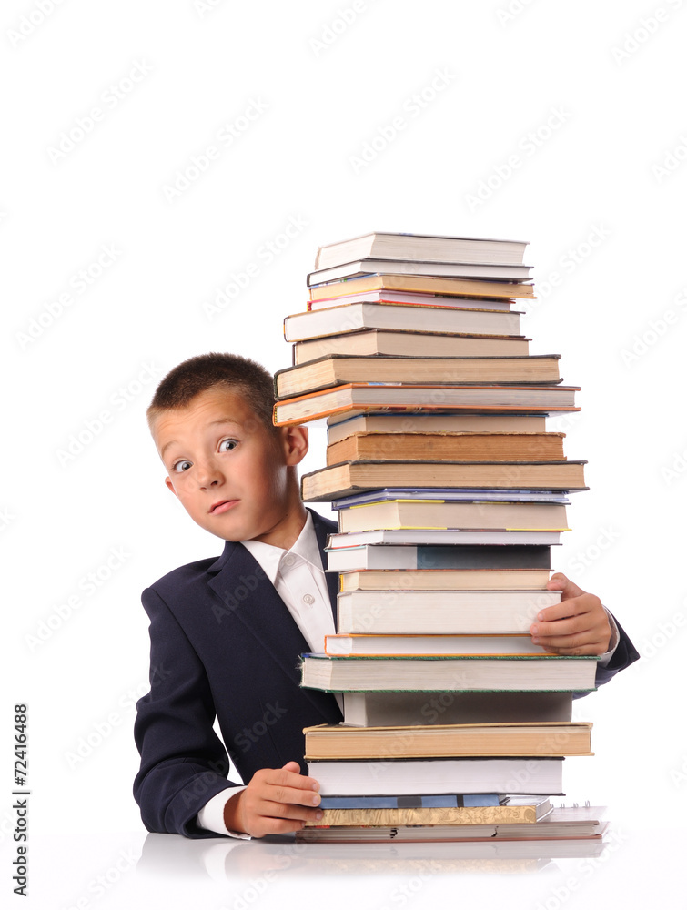 Schoolboy with huge stack of books Schoolboy with huge stack of books