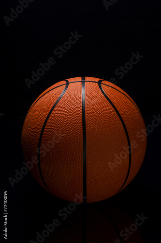 Basketball on black background © aleksandarfilip