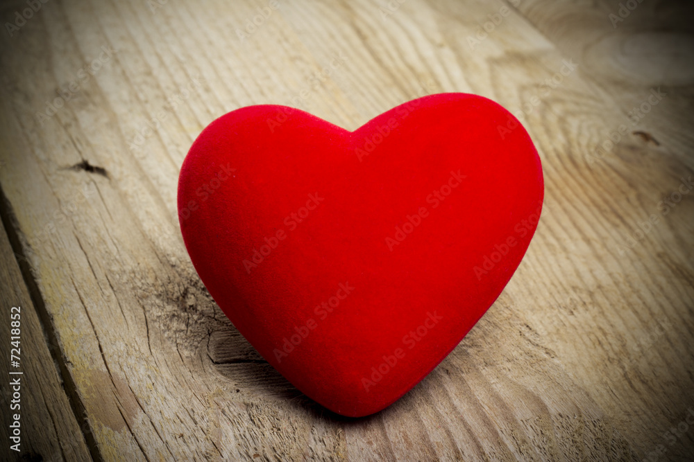 Red heart on a background of wood Red heart on a background of wood