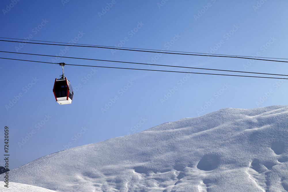 Gondola lift and off-piste slope at sun morning Gondola lift and off-piste slope at sun morning