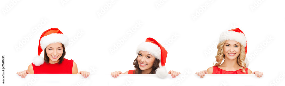women in santa helper hat with blank white board women in santa helper hat with blank white board