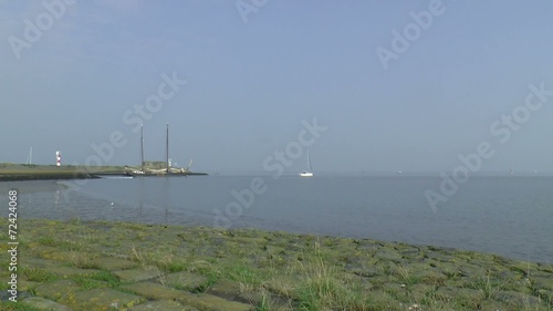 Historic freight ship is sailing north of Den Oever photo