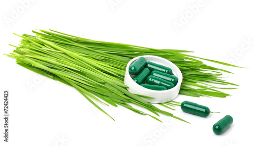 Green grass, tablets, pills and capsules