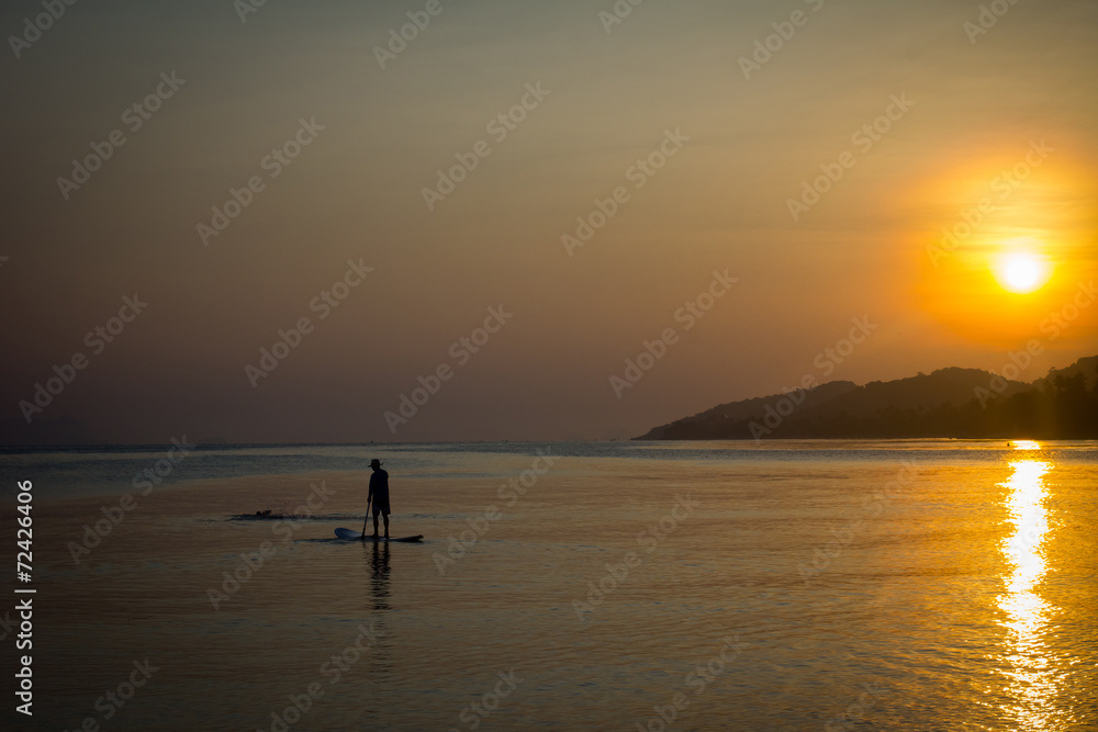 Fishing Boat with fisherman at Sunset on Koh Samui